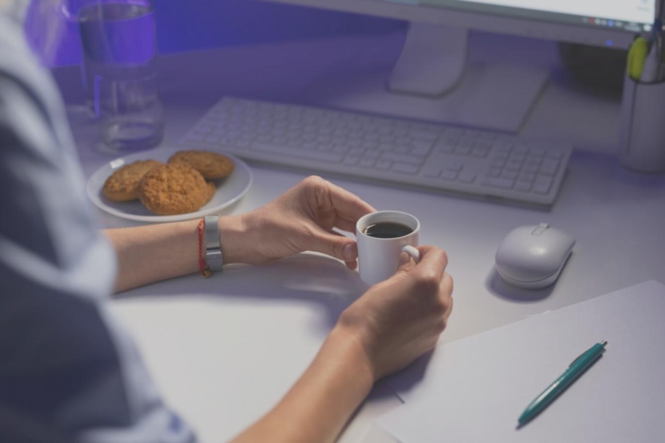 Finance professional reviewing budget performance reports at a workstation