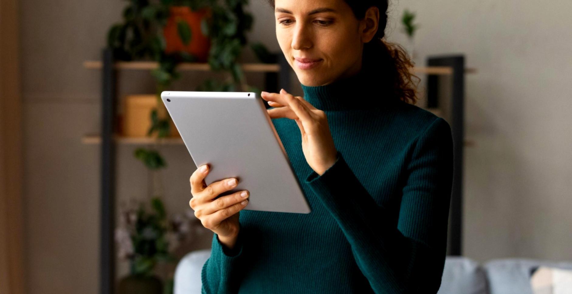 Finance professional reviewing budget performance reports at a workstation